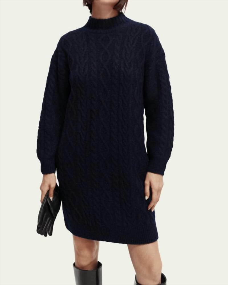 Front of a model wearing a size Large Cable Knit Sweater Mini Dress In Black in Black by SCOTCH & SODA. | dia_product_style_image_id:346437